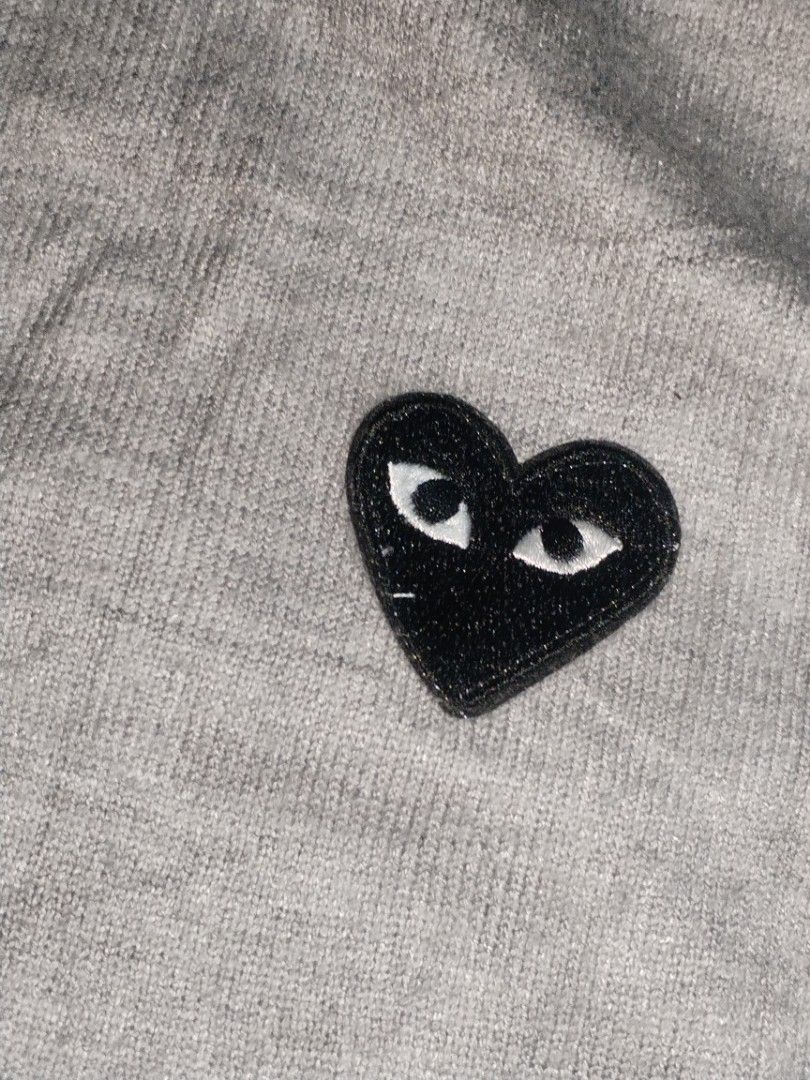 Comme des Garçons PLAY Cardigan (Grey) (Category: Coats, Jackets and Outerwear) located in Baguio. Submitted by luxeloom099 (Listing ID 1469049026, Image 3). Description: Comme des Garçons PLAY Cardigan (Grey) ​Authentic Comme des Garçons PLAY crewneck cardigan in light grey. Made in Japan from 100% fine wool, featuring the iconic embroidered black heart logo on the chest and button-front closure. ​Condition: [Insert Condition] ​Size: Small size 