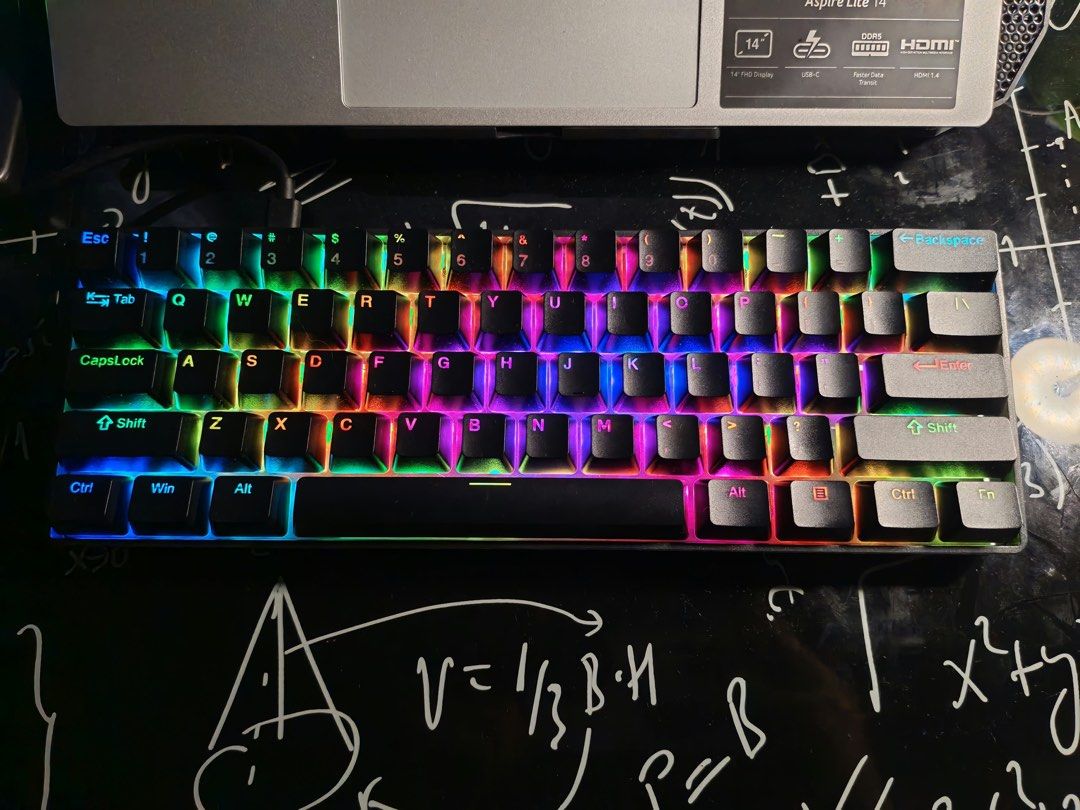 Compact Mechanical Keyboard with RGB Backlight (Category: Computer Keyboard) located in Pasig City. Submitted by hzlfaustino (Listing ID 1469101747, Image 1). Description: - Type: Compact 60% mechanical keyboard - Color: Sleek black housing with clear keycap legends - Lighting: Vibrant RGB backlighting (rainbow wave, solid red, and more) - Connectivity: Wired plug-and-play - Usage: Ideal for space-saving gaming and clean desk setups.
