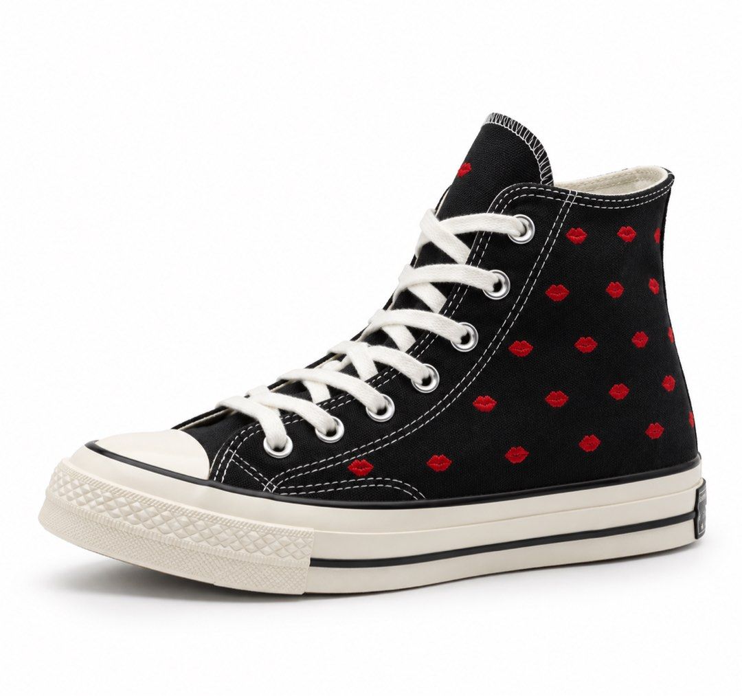 Converse Chuck 70 High Top Black Red Lips (Category: Sneakers) located in Taytay. Submitted by theziatique (Listing ID 1468982243, Image 1). Description: Black canvas high-top sneakers. Red embroidered lips pattern covering the upper. White rubber toe cap and thick midsole with black pinstripe detailing. White laces through metal eyelets. High-top silhouette with structured ankle support. Classic Converse heel patch at the back. Clean white laces