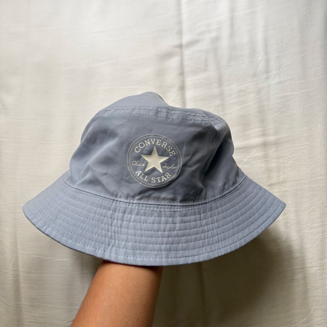 Converse Chuck Taylor All Star Bucket Hat M/L (Category: Caps & Hats) located in Pasig City. Submitted by notshynotmeee (Listing ID 1468959982, Image 2). Description: - Brand: Converse - Design: Reversible (Grey and Light Blue) - Details: Classic Chuck Taylor All Star patch on the front - Size: M/L - Material: 100% Polyester - Condition: Clean with original tags attached (Model: 10024855-A05-416).