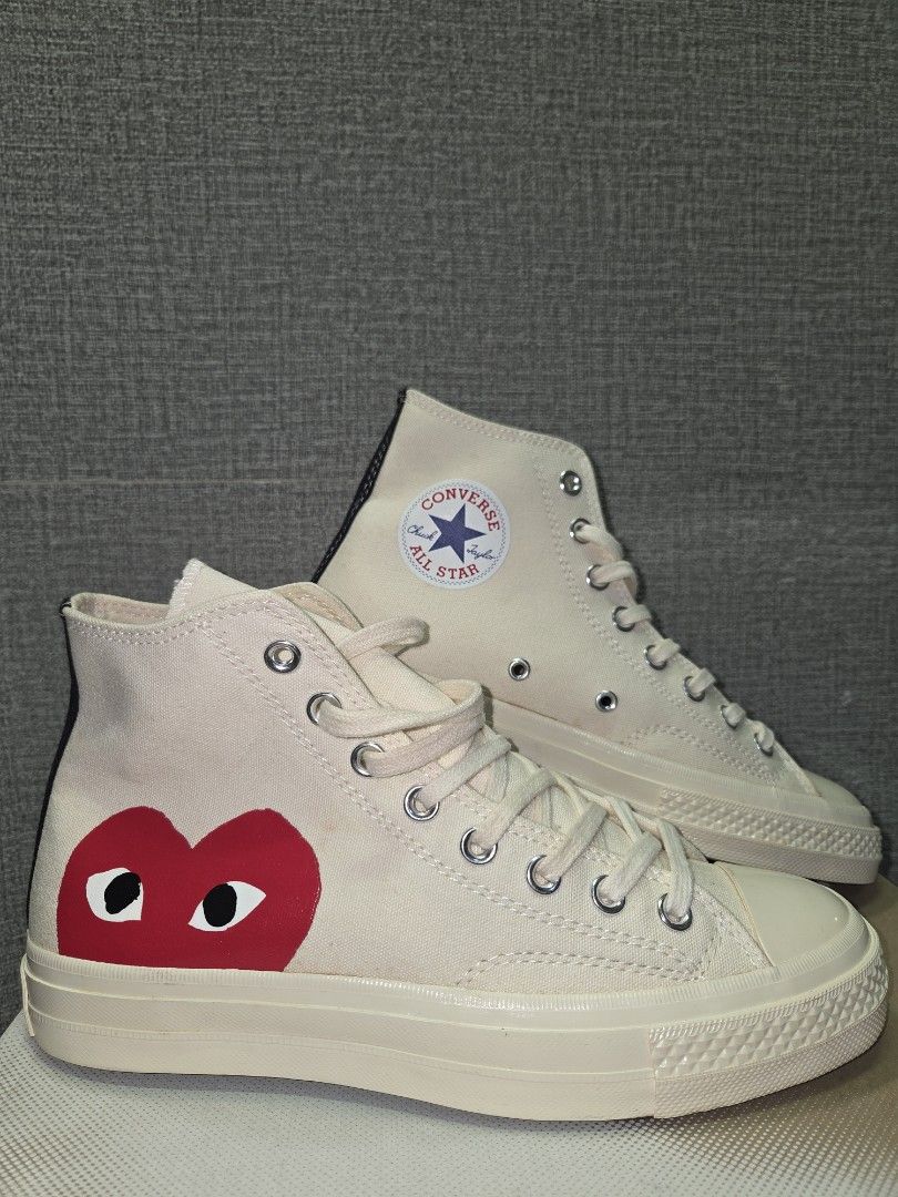 Converse x Comme des Garcons PLAY Chuck 70 High Top (Category: Sneakers) located in Manila. Submitted by isen45 (Listing ID 1469117005, Image 1). Description: - Brand/Model: CDG Play x Converse High-Top Sneakers - Color: Off-White / Milk - Details: Iconic red heart with eyes graphic, black heel stripe, classic All Star ankle patch - Condition: Gently worn, minor discoloration spots on canvas upper - Inclusions: Comes with original box and cream l