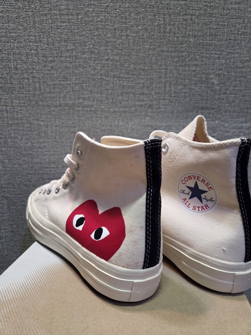 Converse x Comme des Garcons PLAY Chuck 70 High Top (Category: Sneakers) located in Manila. Submitted by isen45 (Listing ID 1469117005, Image 3). Description: - Brand/Model: CDG Play x Converse High-Top Sneakers - Color: Off-White / Milk - Details: Iconic red heart with eyes graphic, black heel stripe, classic All Star ankle patch - Condition: Gently worn, minor discoloration spots on canvas upper - Inclusions: Comes with original box and cream l
