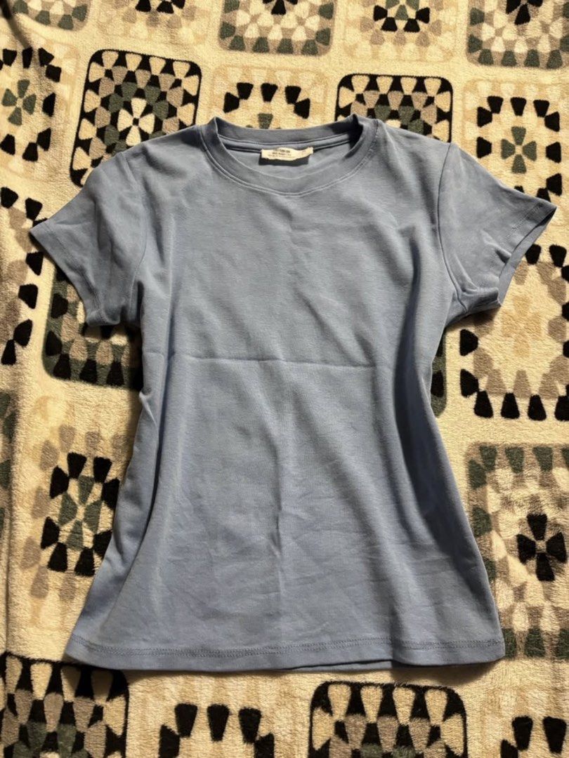 Cotton On baby tee (Category: Shirts) located in Manila. Submitted by inishafaith.g (Listing ID 1469020303, Image 2). Description: AUTHENTIC COTTON ON TOP 🩵 - NEVER BEEN USED - Brand: Cotton On - Size: XS - Color: Light pastel blue - Style: 90s baby tee, crew neckline, short sleeves - Condition: Great basic top for everyday outfits - Origin: Made in Bangladesh.