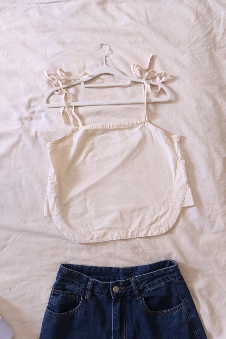 Cream cami top with tie straps (Category: Sleeveless) located in Manila. Submitted by imama23 (Listing ID 1468952082, Image 1). Description: Color: Cream Style: Cami top with self-tie shoulder straps Condition: 8/10 Size: S-M Location: Manila (near taft) Shipping - Payment first before shipping - J&T, Grab, or Lalamove (buyer may choose preferred courier) - MOP: GCASH, Bank Transfer - Shipping to be shouldered by buyer .