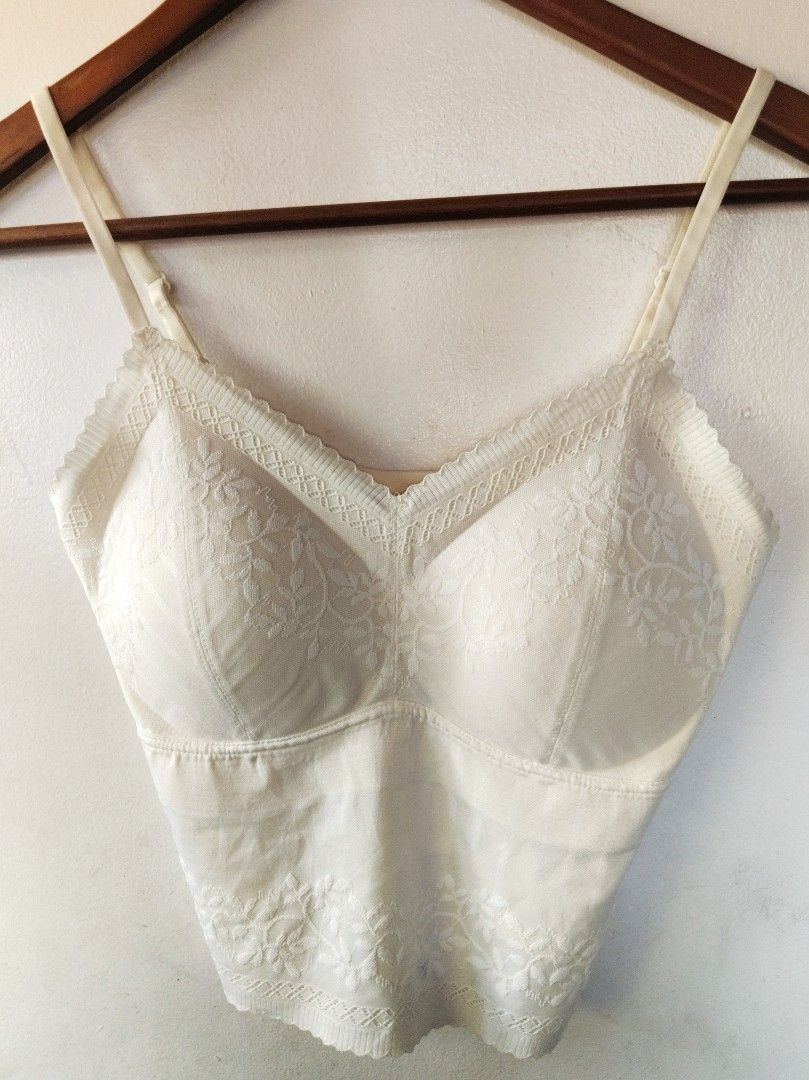 Cream Lace Padded Camisole Top (Category: Sleeveless) located in San Juan City. Submitted by rhennx (Listing ID 1469049929, Image 1). Description: - Color: Cream - Has stain at the back (see photos) - Style: V-neck camisole with floral lace trim on neckline and hem - Features: Built-in padding, adjustable straps, lightweight and stretchy fabric - Fit: Regular - Condition: Pre-loved with noticeable gray smudges on the back side (priced accordingly