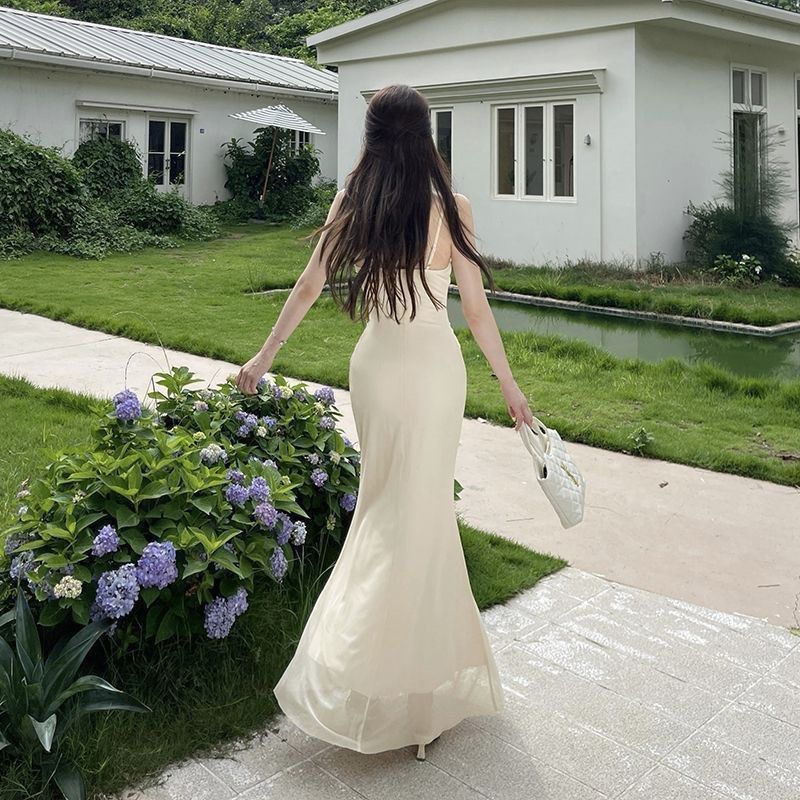 Cream Spaghetti Strap Ruched Maxi Dress (Category: Dresses) located in Taguig. Submitted by mengxir20193848 (Listing ID 1469086436, Image 3). Description: - Color: Cream - Style: Spaghetti strap maxi dress with a cowl neckline and ruched bodice - Fit: Body-hugging through the hips with slight stretch for comfort - Details: Sheer mesh hem layer at the bottom - Condition: Worn once for a photoshoot, excellent overall condition.