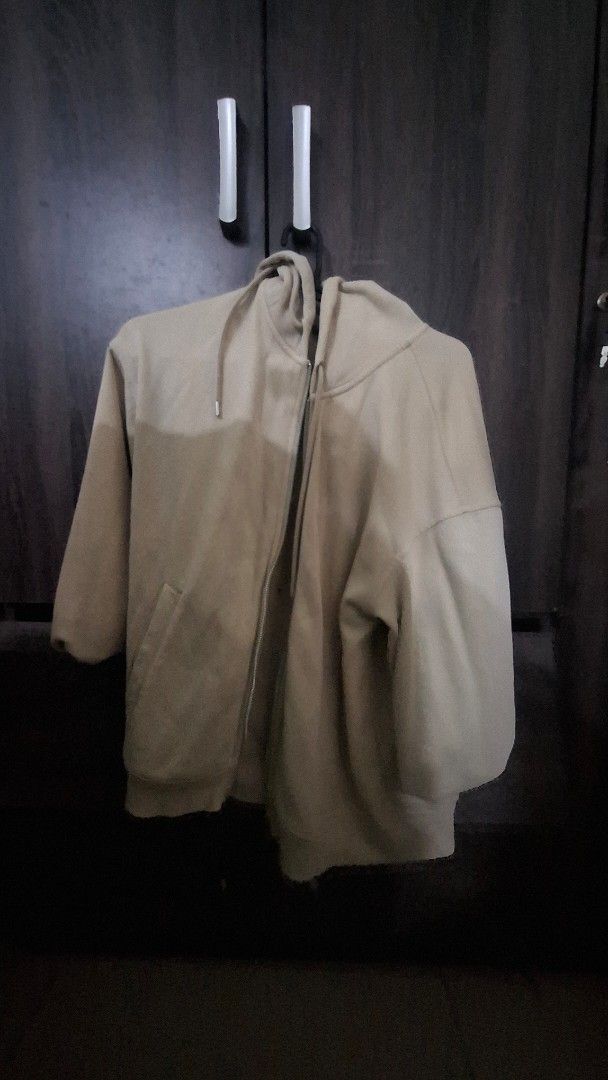 Cream zip up hoodoe (Category: Coats, Jackets and Outerwear) located in Manila. Submitted by matter514 (Listing ID 1469117914, Image 1). Description: - Color: Versatile neutral beige that goes with everything - Material: Warm and comfortable cotton blend - Design: Full front zipper with matching drawstrings on the hood - Features: Practical front pockets for daily essentials - Fit: Standard fit, great for everyday wear.