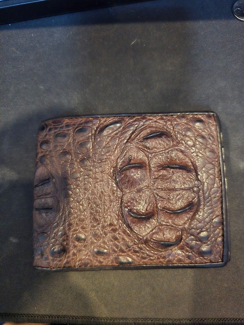 Crocodile Leather Bifold Wallet (Category: Wallets & Card holders) located in Manila. Submitted by dsb1705 (Listing ID 1469098405, Image 1). Description: Crocodile Leather Wallet Price: 3000 PHP (Negotiable) Bought from Bangkok Chatuchak Market at October 2026. Used around 5 times then kept in storage. Genuine crocodile leather (see last pic) RFS: Not my style.
