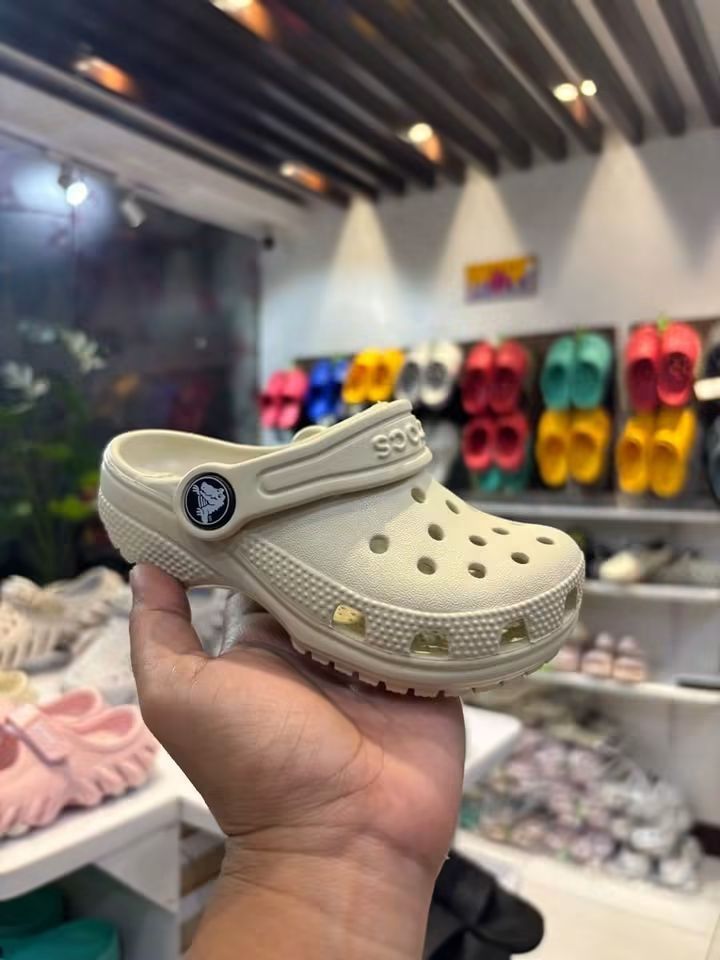 Crocs Classic Clog with Jibbitz Charms (Category: Babies & Kids Fashion) located in Cebu City. Submitted by madeskartegirl (Listing ID 1468982077, Image 3). Description: - Brand new with tags attached - Super comfy and lightweight foam slip-on design - Colors available: Pink and Beige/Cream - Comes pre-decorated with cute Jibbitz charms (butterflies, unicorns, and flowers) - Ideal for stylish, everyday casual wear.