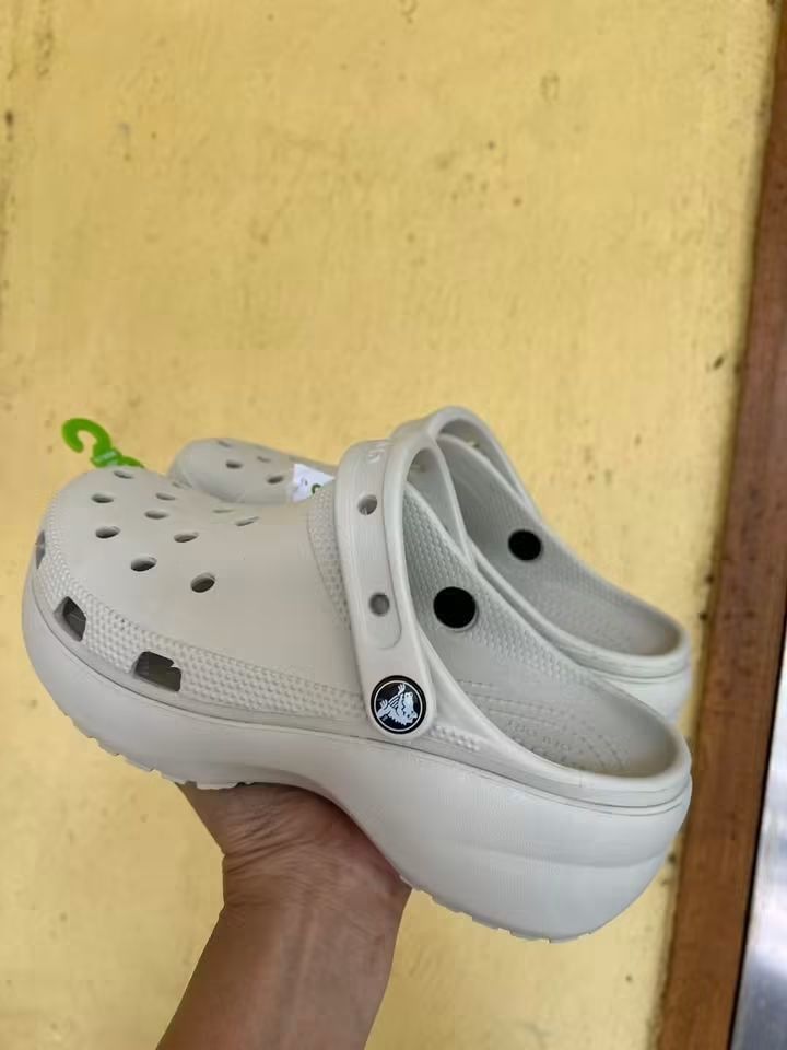 Crocs Classic Crush Clogs Bone (Category: Slippers and slides) located in Cebu City. Submitted by madeskartegirl (Listing ID 1468980630, Image 3). Description: size 5-11 available - Color: Bone white - Style: Chunky platform clogs - Condition: Brand new with original tags attached - Features: Lightweight foam construction, breathable ventilation holes, and pivoting heel strap with metal rivet branding - Perfect for adding height while staying com
