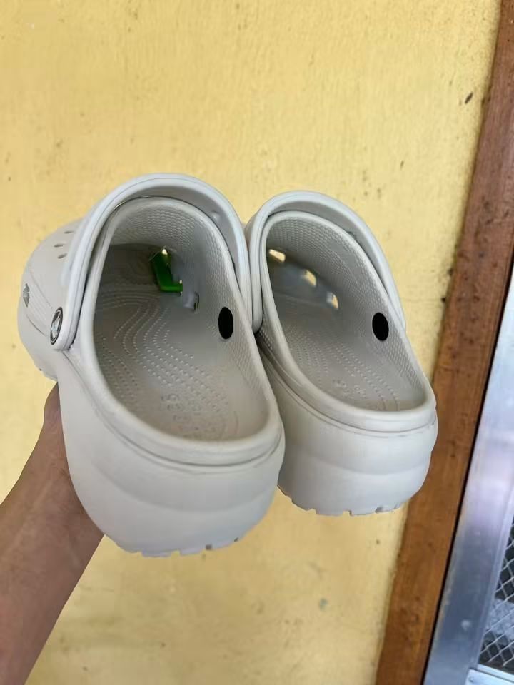 Crocs Classic Crush Clogs Bone (Category: Slippers and slides) located in Cebu City. Submitted by madeskartegirl (Listing ID 1468980630, Image 2). Description: size 5-11 available - Color: Bone white - Style: Chunky platform clogs - Condition: Brand new with original tags attached - Features: Lightweight foam construction, breathable ventilation holes, and pivoting heel strap with metal rivet branding - Perfect for adding height while staying com