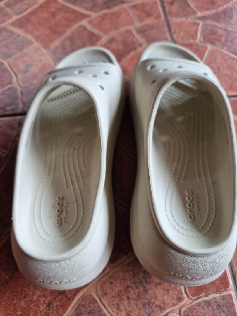 Crocs Crush Slide Bone Cream Sandals (Category: Sandals) located in Caloocan City. Submitted by munchie787906 (Listing ID 1469060122, Image 3). Description: - Color: Bone cream - Style: Platform slides with open toe and chunky sole - Comfort: Iconic Crocs Comfort footbed with breathable upper ventilation holes - Condition: Clean, with minimal signs of wear on the soles - Baguio loc. Can do shipping - size 7W - rfs decluttering - negotiable.