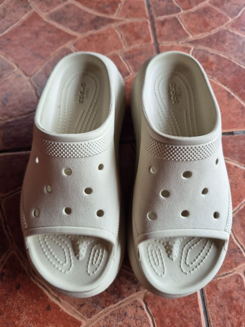 Crocs Crush Slide Bone Cream Sandals (Category: Sandals) located in Caloocan City. Submitted by munchie787906 (Listing ID 1469060122, Image 2). Description: - Color: Bone cream - Style: Platform slides with open toe and chunky sole - Comfort: Iconic Crocs Comfort footbed with breathable upper ventilation holes - Condition: Clean, with minimal signs of wear on the soles - Baguio loc. Can do shipping - size 7W - rfs decluttering - negotiable.