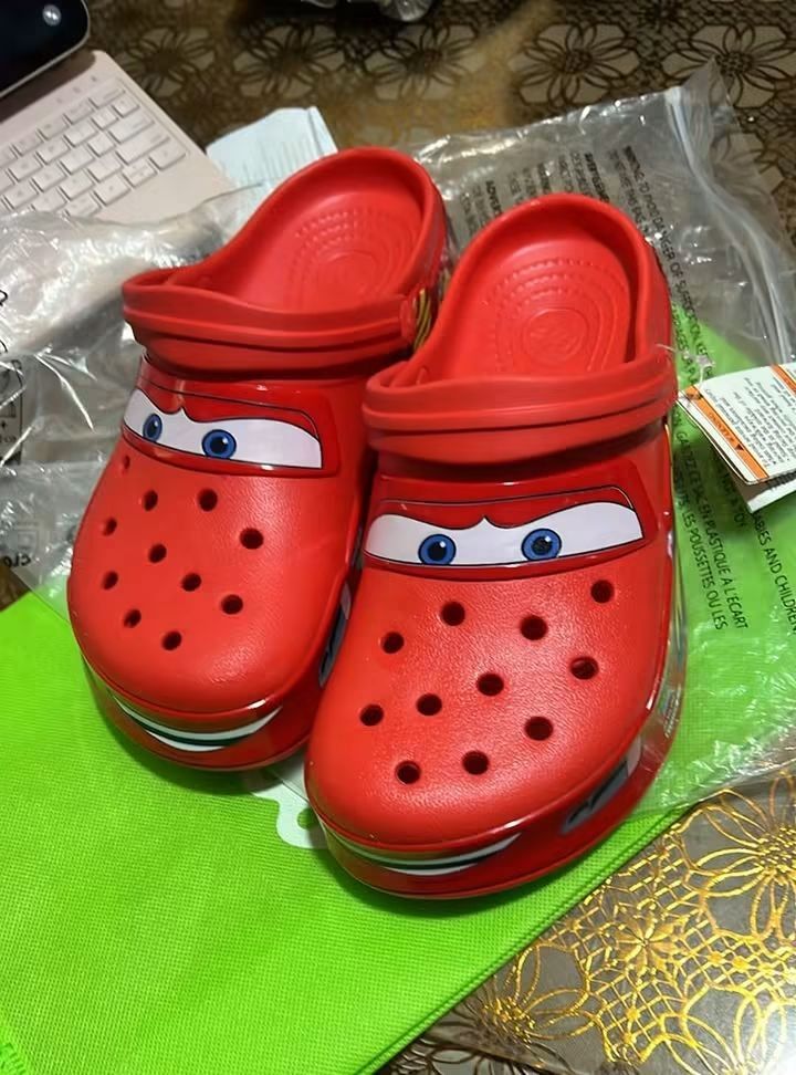 Crocs Disney Pixar Cars Lightning McQueen Clogs (Category: Slippers & Slides) located in Cebu City. Submitted by madeskartegirl (Listing ID 1468980157, Image 3). Description: limited stocks only Brand new with original packaging bags and tag attached - Authentic Lightning McQueen Crocs clogs in bright red - Signature windshield eye graphics on the toe box - Iconic Number 95 and flame graphics printed along the sides - Super fun and comfortable fo
