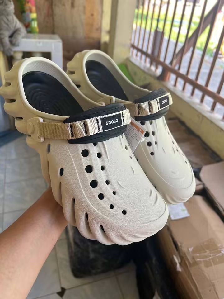 Crocs Echo Clog (Category: Slippers & Slides) located in Cebu City. Submitted by madeskartegirl (Listing ID 1468977308, Image 1). Description: size 6-11 available - Brand new with original tags - Color: Neutral - Style: Chunky molded design with futuristic cutouts - Features: Adjustable top strap with black branded accent - Material: Lightweight foam construction - Fit: Easy slip-on style.