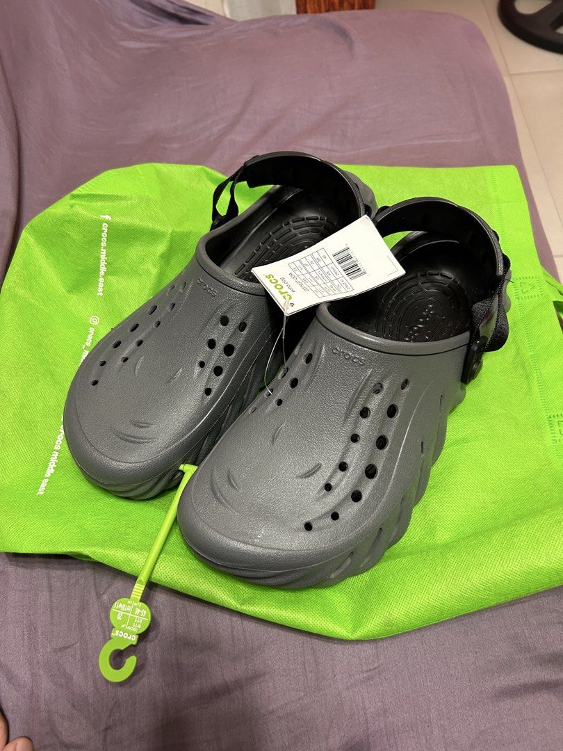 Crocs Echo Clog Grey Size M11 W11 (Category: Slippers & Slides) located in Paranaque City. Submitted by mikhaillll (Listing ID 1469126417, Image 3). Description: - Item: Crocs Echo Clogs - Color: Grey - Size: US M11 / W11 (EUR 45-46, 290mm) - Condition: Brand new with tags (BNWT) - Features: Chunky futuristic design, adjustable heel strap, ventilation holes - Inclusions: Original store hanger and green carrier bag.