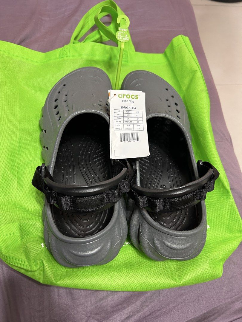 Crocs Echo Clog Grey Size M11 W11 (Category: Slippers & Slides) located in Paranaque City. Submitted by mikhaillll (Listing ID 1469126417, Image 2). Description: - Item: Crocs Echo Clogs - Color: Grey - Size: US M11 / W11 (EUR 45-46, 290mm) - Condition: Brand new with tags (BNWT) - Features: Chunky futuristic design, adjustable heel strap, ventilation holes - Inclusions: Original store hanger and green carrier bag.