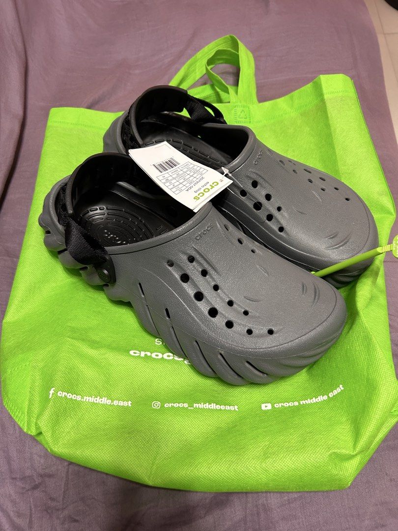 Crocs Echo Clog Grey Size M11 W11 (Category: Slippers & Slides) located in Paranaque City. Submitted by mikhaillll (Listing ID 1469126417, Image 1). Description: - Item: Crocs Echo Clogs - Color: Grey - Size: US M11 / W11 (EUR 45-46, 290mm) - Condition: Brand new with tags (BNWT) - Features: Chunky futuristic design, adjustable heel strap, ventilation holes - Inclusions: Original store hanger and green carrier bag.