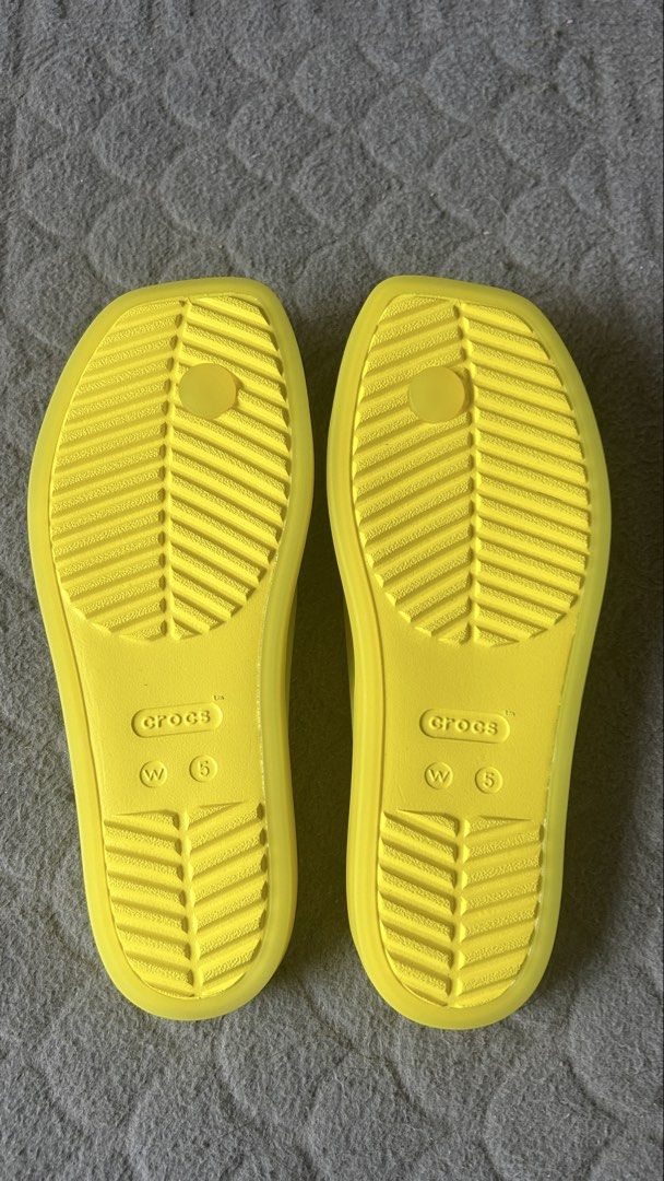Crocs Yellow Flip Flops Size W5 (Category: Slippers and slides) located in Paranaque City. Submitted by jesseygirl83 (Listing ID 1468973472, Image 2). Description: - Brand: Crocs - Style: Flip flops / thong strap - Color: Bright yellow - Size: Women's US 5 - Features: Lightweight foam construction, textured footbed, grooved rubber soles - Ideal for: Summer beach trips, pool days, or everyday casual wear - Never used just stored inside the shoe ca