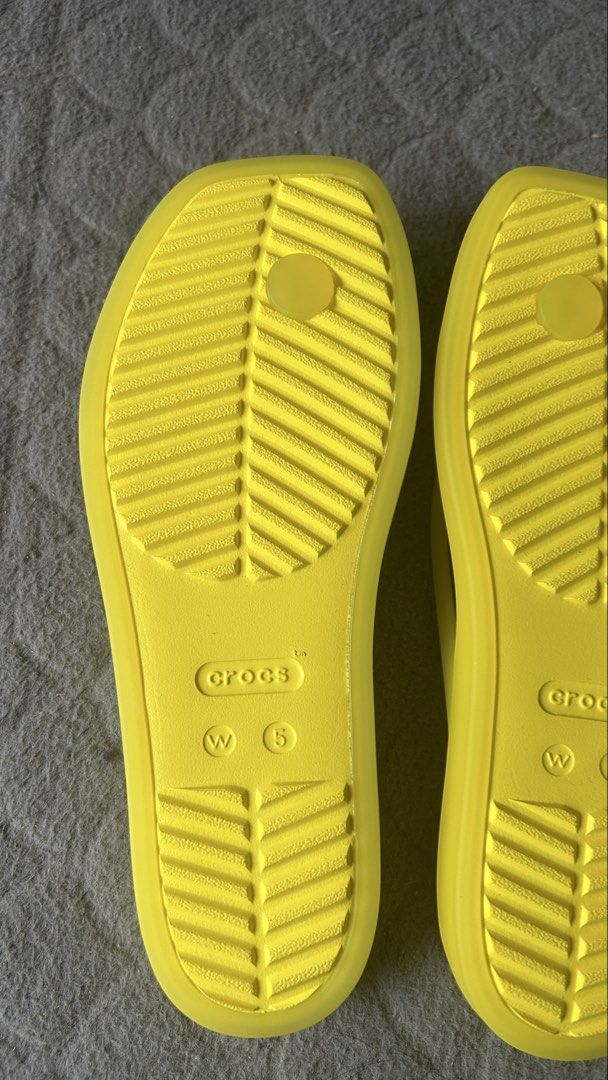 Crocs Yellow Flip Flops Size W5 (Category: Slippers and slides) located in Paranaque City. Submitted by jesseygirl83 (Listing ID 1468973472, Image 3). Description: - Brand: Crocs - Style: Flip flops / thong strap - Color: Bright yellow - Size: Women's US 5 - Features: Lightweight foam construction, textured footbed, grooved rubber soles - Ideal for: Summer beach trips, pool days, or everyday casual wear - Never used just stored inside the shoe ca