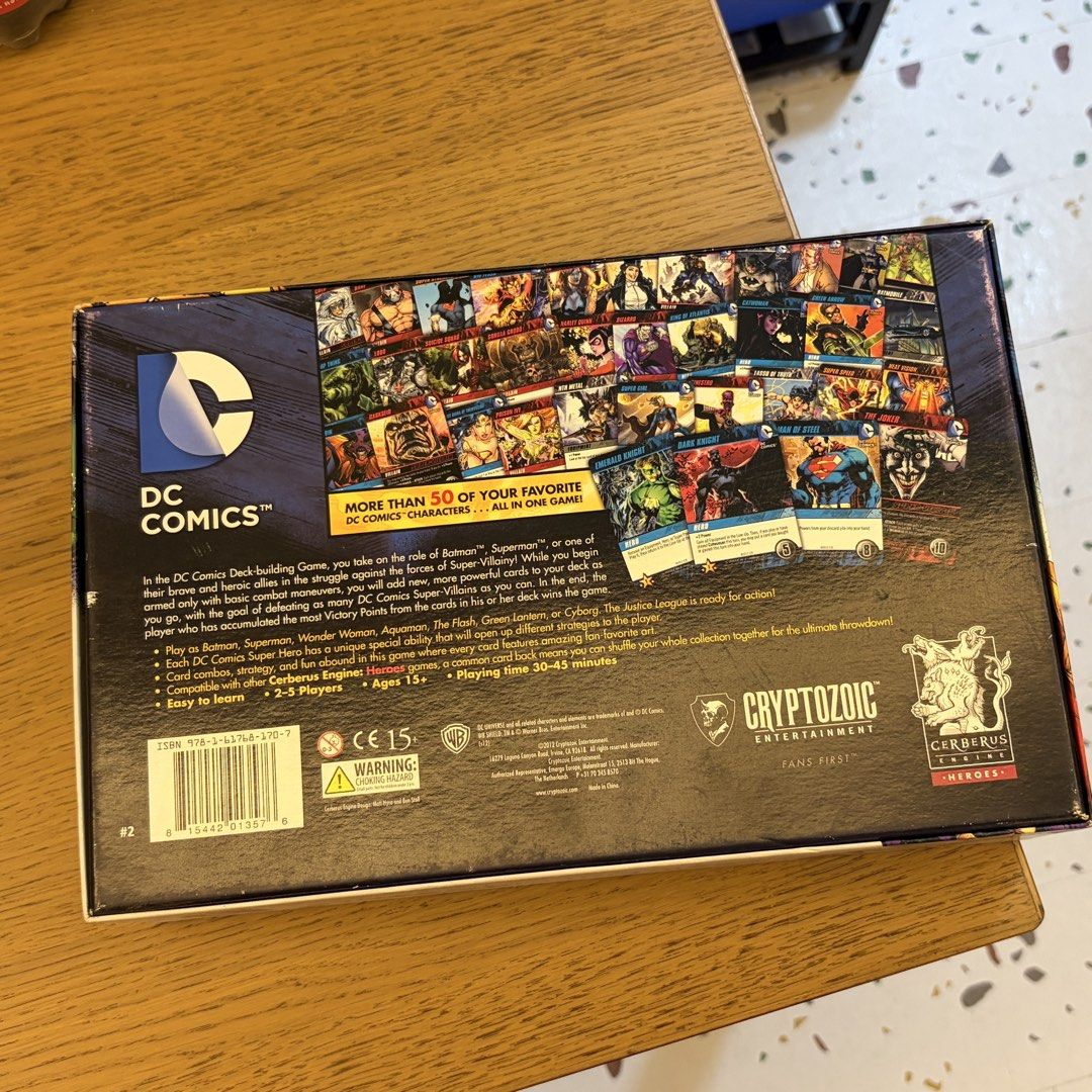 Cryptozoic Entertainment DC Comics Deck-Building Game (2012) (Category: Board Games & Puzzles) located in Cavite. Submitted by jace.themerchant (Listing ID 1469084825, Image 2). Description: Cryptozoic Entertainment DC Comics Deck-Building Game (2012) Package include: Original Box 1 Rulebook 7 Oversized Sealed Super Hero Cards (I used some proxy when I played this before so I didn’t need to open the packaging 214 Game Cards •36 Punch Starting Car