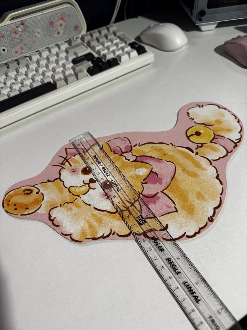 Cute cat mousepad pink orange fluffy kitten desk mat (Category: Mouse & Mousepads) located in Penaranda. Submitted by deardarlaph_ (Listing ID 1468935567, Image 3). Description: - Adorable orange and white cat design with a cute pink bow - Soft surface featuring a lovely watercolor illustration style - Non-slip white rubber backing keeps it firmly in place - Measures approximately 27cm across - Perfect for adding a cheerful touch to your desk set