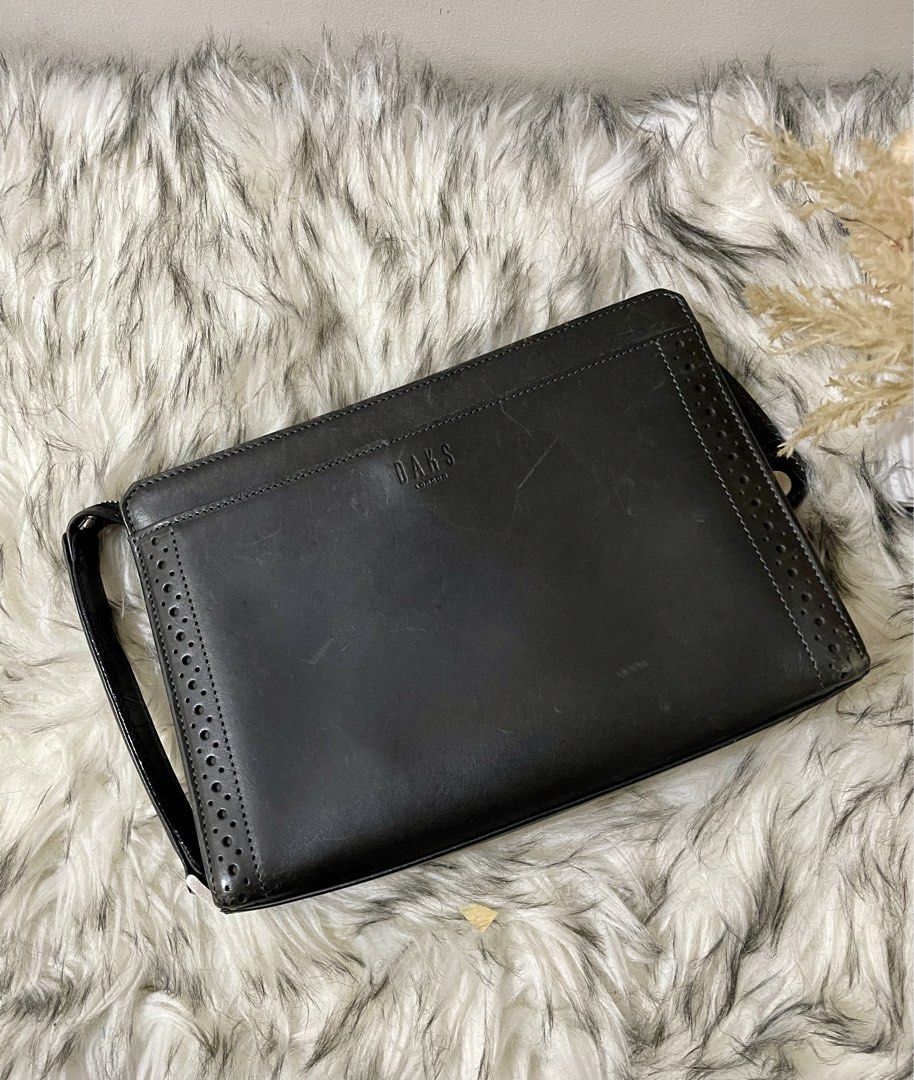 Daks Black Leather Clutch Bag (Category: Belt bags, Clutches and Pouches) located in Teresa. Submitted by savvyonbranded (Listing ID 1469055612, Image 2). Description: 7 x 10.5 x 2.5 inches.