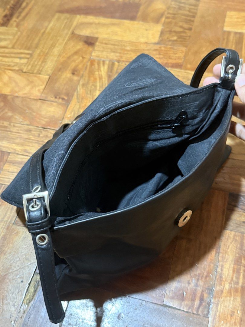 Daniel Ray Black Leather Shoulder Bag (Category: Shoulder Bags) located in Manila. Submitted by only_alyssacloset (Listing ID 1469012530, Image 3). Description: Brand: Daniel Ray Color: Black Closure: Fold-over flap with magnetic snap Storage: Main zipped compartment plus an interior zip pocket for essentials Details: Premium branded interior lining Size: Small shoulder bag.