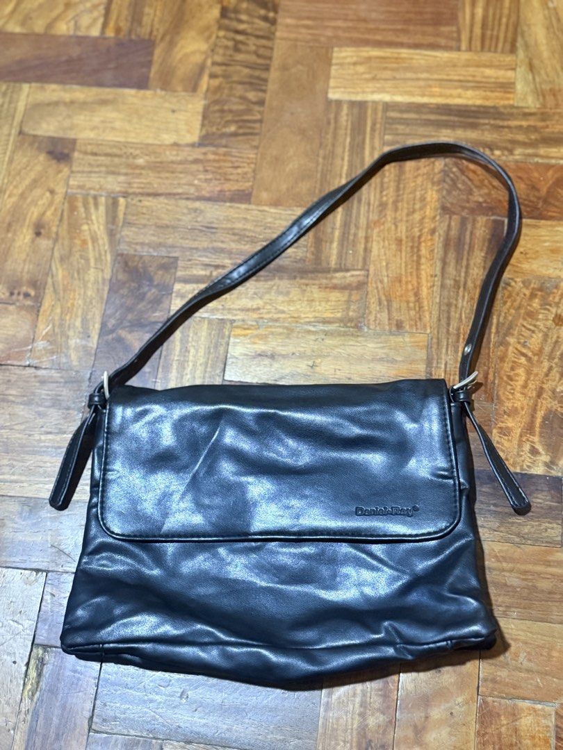 Daniel Ray Black Leather Shoulder Bag (Category: Shoulder Bags) located in Manila. Submitted by only_alyssacloset (Listing ID 1469012530, Image 2). Description: Brand: Daniel Ray Color: Black Closure: Fold-over flap with magnetic snap Storage: Main zipped compartment plus an interior zip pocket for essentials Details: Premium branded interior lining Size: Small shoulder bag.