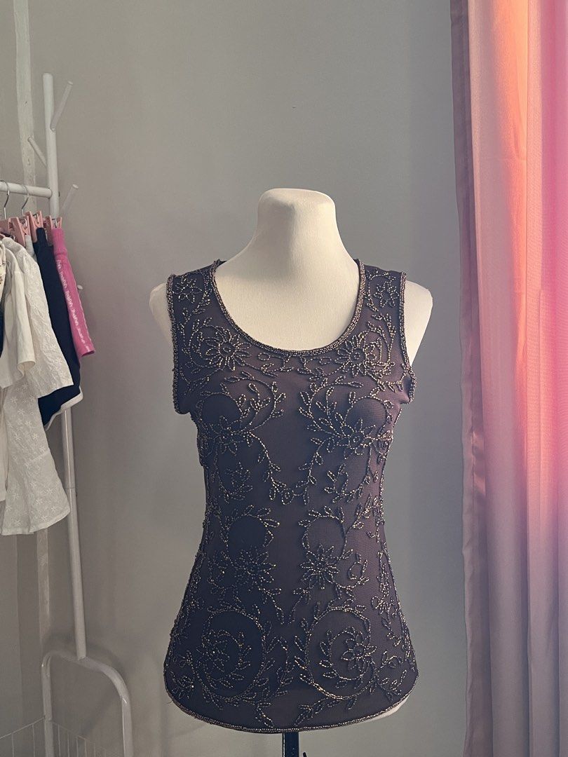 Dark Brown Beaded Floral Sleeveless Top (Category: Sleeveless) located in Manila. Submitted by schiiiiiii (Listing ID 1468931894, Image 1). Description: - Style: Sleeveless top with a fitted silhouette and scoop neckline - Design: Intricate metallic beadwork forming all-over floral patterns on the front - Color: Dark brown - Occasion: Perfect for dinner outs and evening events - Details: High-quality, detailed needlework throughout.