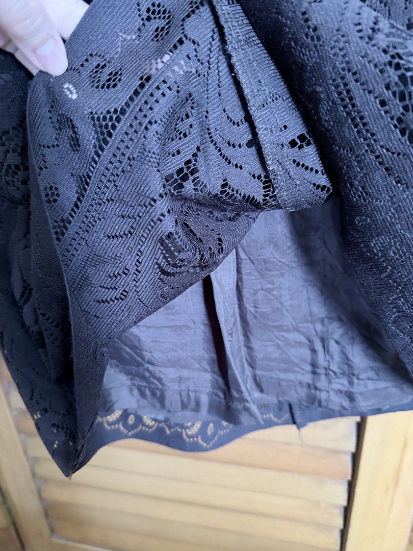 Dark Brown Lace Skirt (Category: Skirts) located in Paranaque City. Submitted by roanclauds (Listing ID 1468955906, Image 2). Description: - Brand: BCBG - Size: M - Color: Dark Brown - Material: Floral lace overlay with solid dark lining - Fit: Structured waistband with a clean zip-free pull-on design - Length: Knee-length - Occasion: Ideal for night outs, dates, and formal dinners - Condition: Excellent designer wardrobe staple.