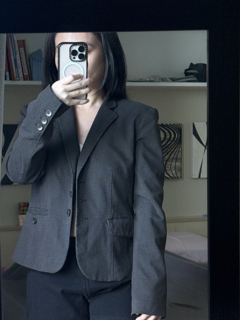 Dark Grey Tailored Office Blazer with Button Cuffs (Category: Coats, Jackets and Outerwear) located in Pasig City. Submitted by laagn.ph (Listing ID 1469090160, Image 3). Description: - Color: Dark grey with subtle texture - Fit: Fitted silhouette with structured shoulders - Details: Notched lapels, front button closure, decorative cuff buttons - Pockets: Functional hip flap pockets - Style: Versatile professional wear and great layering piece fo