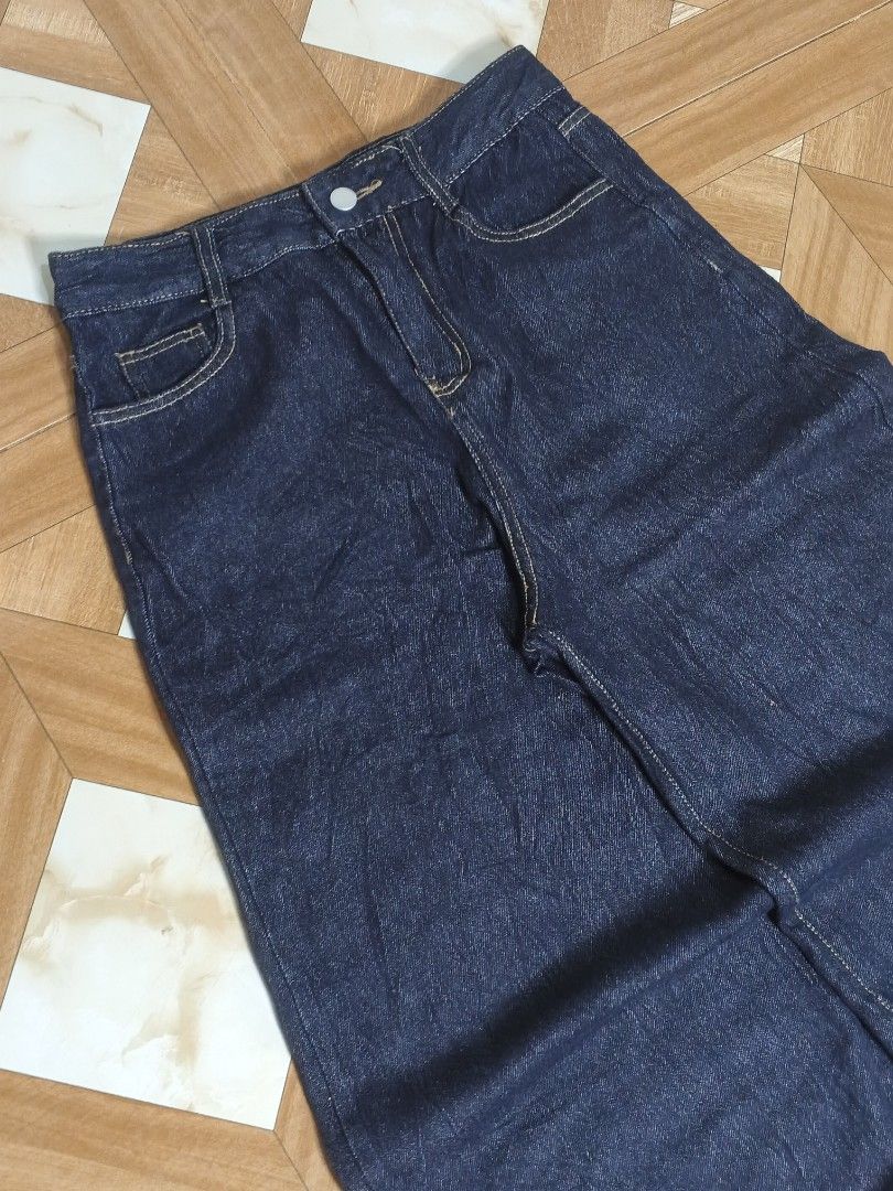 Dark wash denim maxi skirt (Category: Jeans) located in Manila. Submitted by dp.finds (Listing ID 1469122361, Image 3). Description: - Color: Dark blue denim - Style: Straight cut maxi length - Waist: Mid-rise with belt loops and button closure - Details: Contrasting yellow stitching and front pockets - Condition Excellent (ready to wear).