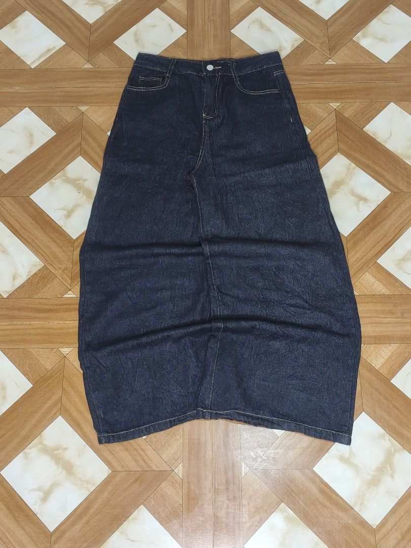 Dark wash denim maxi skirt (Category: Jeans) located in Manila. Submitted by dp.finds (Listing ID 1469122361, Image 1). Description: - Color: Dark blue denim - Style: Straight cut maxi length - Waist: Mid-rise with belt loops and button closure - Details: Contrasting yellow stitching and front pockets - Condition Excellent (ready to wear).