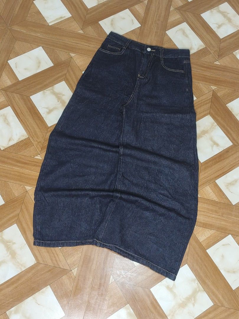 Dark wash denim maxi skirt (Category: Jeans) located in Manila. Submitted by dp.finds (Listing ID 1469122361, Image 2). Description: - Color: Dark blue denim - Style: Straight cut maxi length - Waist: Mid-rise with belt loops and button closure - Details: Contrasting yellow stitching and front pockets - Condition Excellent (ready to wear).