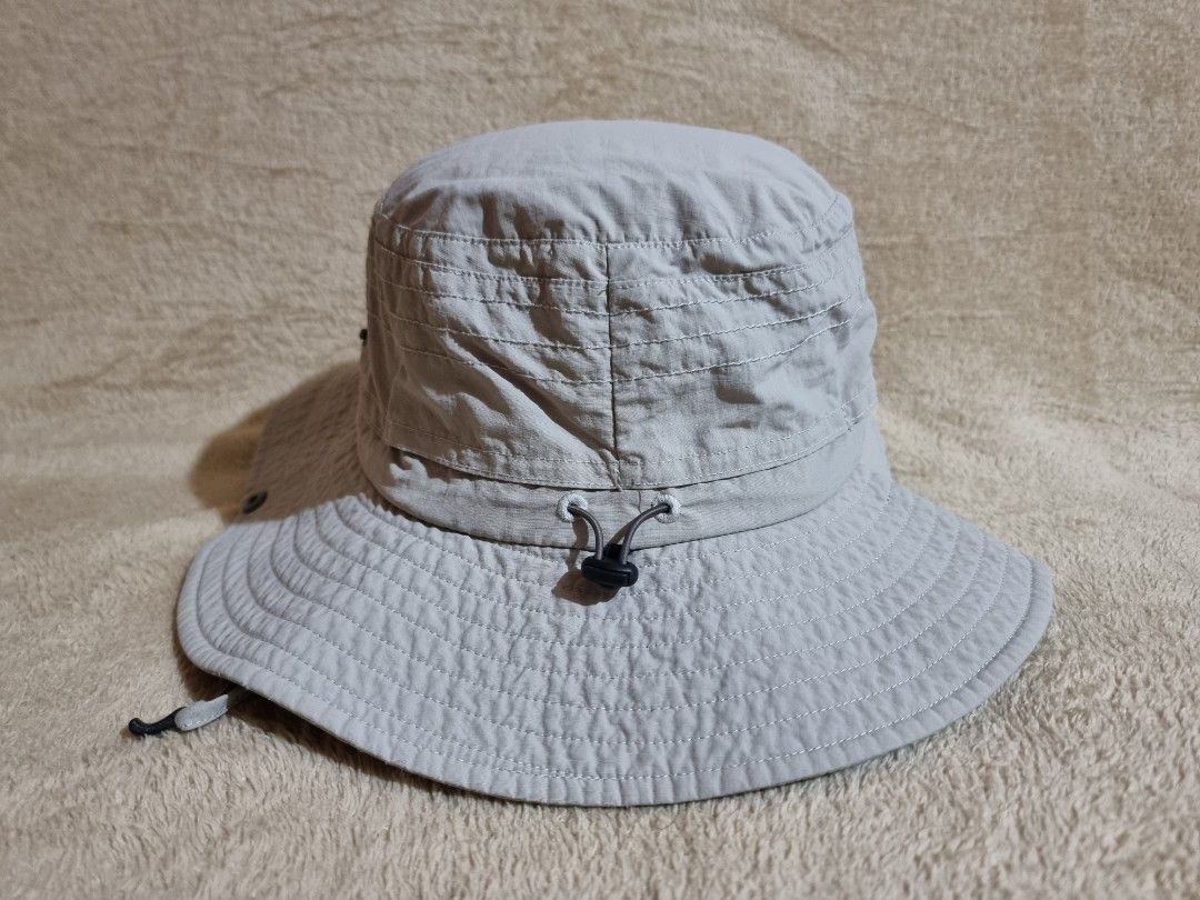 Decathlon Forclaz Trekking Bucket Hat (Category: Caps & Hats) located in Imus. Submitted by aim_for_less (Listing ID 1469050579, Image 3). Description: Decathlon Forclaz Trekking Bucket Hat - Brand/Model: Forclaz Outdoor Sun Hat - SZIE: M/L (58-60cm) - Color: Light grey - Wide brim provides solid shade for hiking and trekking - Secure adjustable chin strap with toggle for windy days - Side ventilation eyelets to keep your head cool - Back drawstr