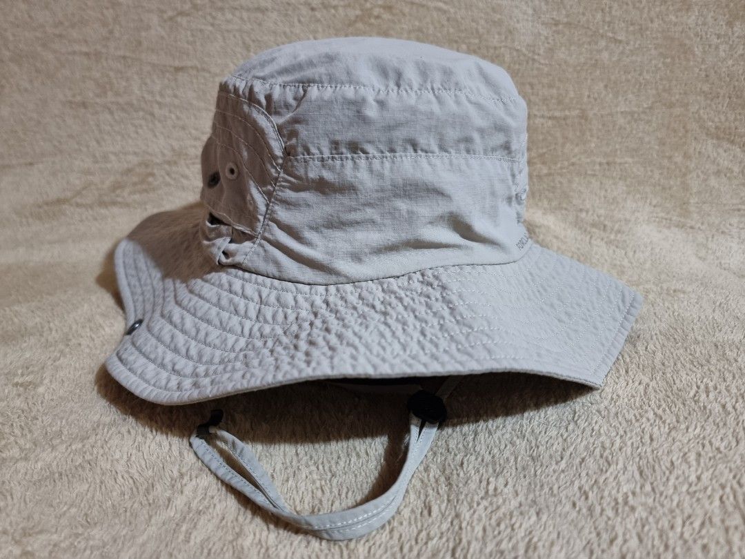 Decathlon Forclaz Trekking Bucket Hat (Category: Caps & Hats) located in Imus. Submitted by aim_for_less (Listing ID 1469050579, Image 1). Description: Decathlon Forclaz Trekking Bucket Hat - Brand/Model: Forclaz Outdoor Sun Hat - SZIE: M/L (58-60cm) - Color: Light grey - Wide brim provides solid shade for hiking and trekking - Secure adjustable chin strap with toggle for windy days - Side ventilation eyelets to keep your head cool - Back drawstr
