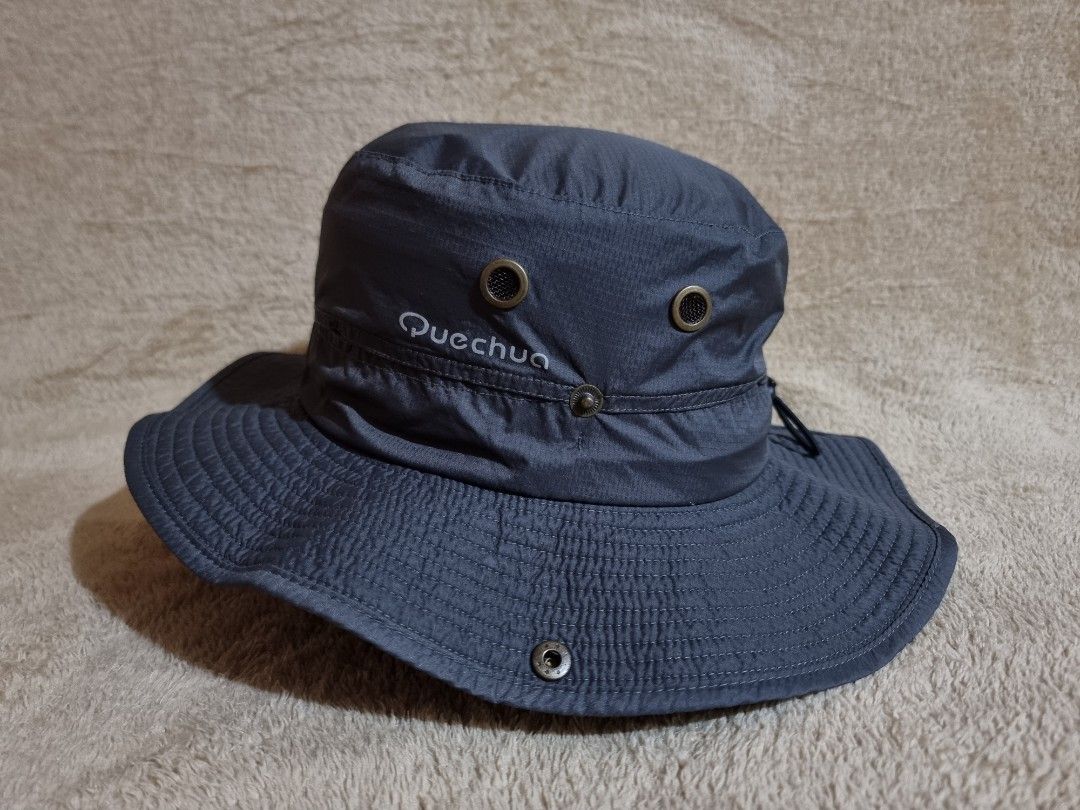 Decathlon Quechua Hiking Bucket Hat (Category: Caps & Hats) located in Imus. Submitted by aim_for_less (Listing ID 1469049030, Image 2). Description: Decathlon Quechua Hiking Bucket Hat - Brand: Quechua outdoor sun hat - SIZE: M/L (58-60cm) - Color: Dark grey - Wide brim provides solid sun protection - Side metal ventilation eyelets keep you cool - Adjustable chin strap with toggle for a secure fit - Snap buttons on sides to pin up the brim - Dur