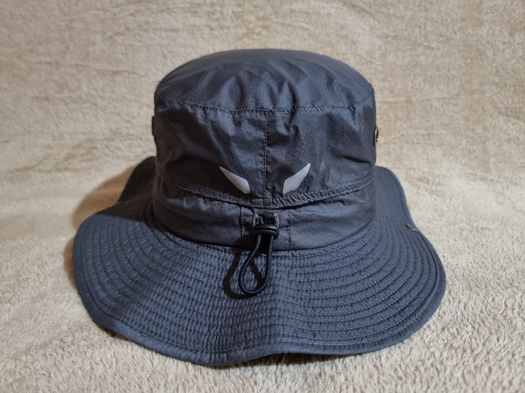 Decathlon Quechua Hiking Bucket Hat (Category: Caps & Hats) located in Imus. Submitted by aim_for_less (Listing ID 1469049030, Image 3). Description: Decathlon Quechua Hiking Bucket Hat - Brand: Quechua outdoor sun hat - SIZE: M/L (58-60cm) - Color: Dark grey - Wide brim provides solid sun protection - Side metal ventilation eyelets keep you cool - Adjustable chin strap with toggle for a secure fit - Snap buttons on sides to pin up the brim - Dur
