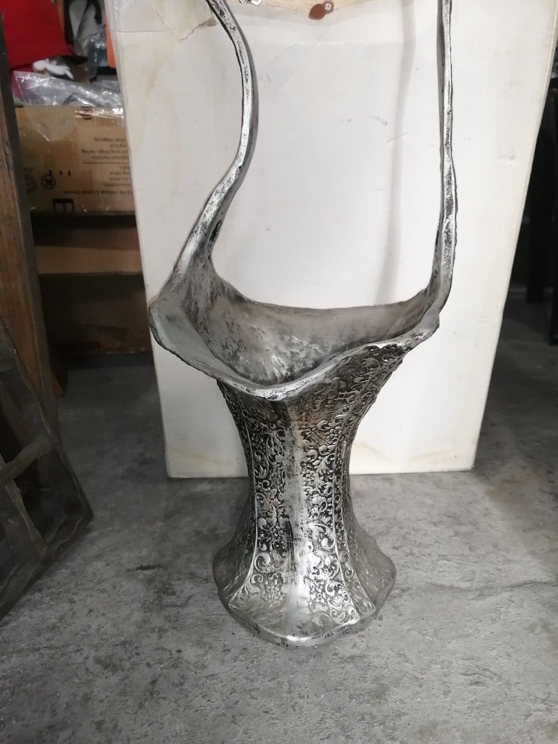Decorative vase (Category: Everything Else Others) located in Paranaque City. Submitted by jhedplus (Listing ID 1469084107, Image 2). Description: Silvered color metal looks like cast aluminum Please read! For sure buyer only! NO COD/COP No reservation The items will be sold to the first payer w/o prior notice. Verbal reservations are not acceptable. Note: All items are vintage. Please manage your expectations accordingly. G cash payment. Shippin