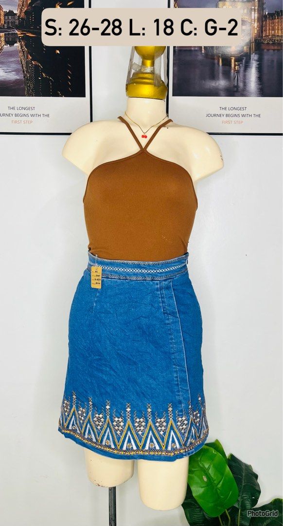 Denim Skirt | Size 26-28 (Category: Skirts) located in Manila. Submitted by bengirlclothing (Listing ID 1468942084, Image 1). Description: SIZE: 26-28 inches LENGTH: 18 inches - Stylish blue denim with detailed embroidery on the hem - Fitted waistband with decorative stitching - Flattering mid-thigh length - Versatile piece, easy to style with basic tops and tees.