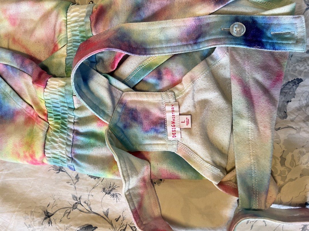 Design History Tie Dye Romper Size L (Category: Babies & Kids Fashion) located in Tabaco. Submitted by edmarbron (Listing ID 1469090093, Image 3). Description: - Brand: Design History - Size: Large - Material: Soft knit - Pattern: Vibrant multicolor tie-dye - Features: Adjustable button straps, elastic waist with drawstring, front chest pocket, and back pockets - Condition: Great pre-loved condition - Perfect for: Casual wear, beach days, and sum