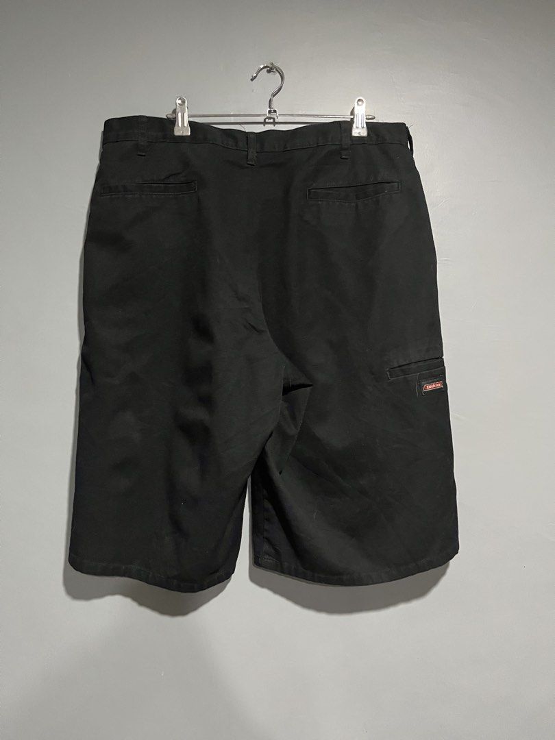 Dickies Black Work Shorts (Category: Shorts) located in Maasin. Submitted by niconii090 (Listing ID 1468985547, Image 2). Description: - Brand: Dickies - Color: Classic Black - Material: Sturdy, durable cotton blend for daily wear - Pockets: Multiple utility pockets for small tools - Details: Woven Dickies logo patch near the hem - Fit/Closure: Belt loops with secure button and zip fly closure -📏 W 35 | L 24 | LEG OPENING 13.