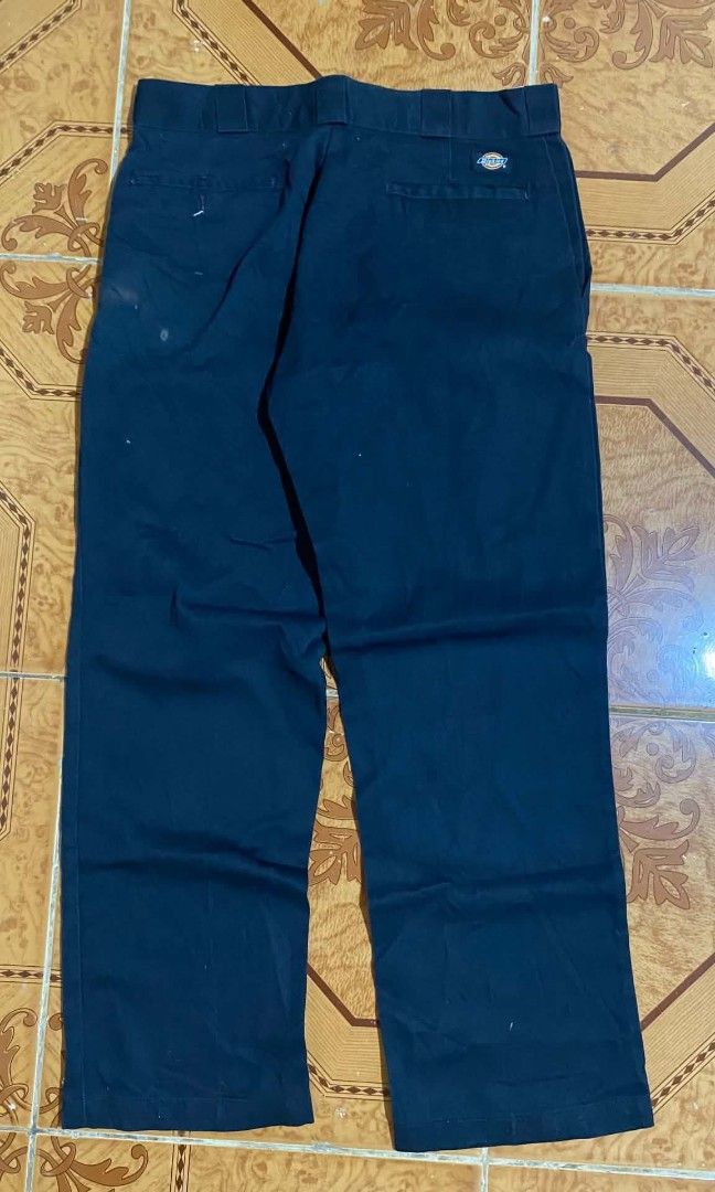 Dickies Work Pants (Category: Trousers) located in Bulacan. Submitted by rondeez (Listing ID 1468950013, Image 1). Description: - Brand: Dickies - Color: Dark blue - Style: Classic work pants with standard fit and belt loops - Features: Durable material, back pockets, and iconic logo tag on the right rear pocket.