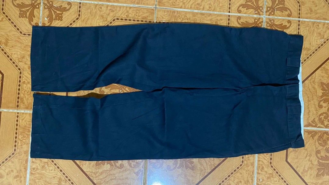 Dickies Work Pants (Category: Trousers) located in Bulacan. Submitted by rondeez (Listing ID 1468950013, Image 3). Description: - Brand: Dickies - Color: Dark blue - Style: Classic work pants with standard fit and belt loops - Features: Durable material, back pockets, and iconic logo tag on the right rear pocket.