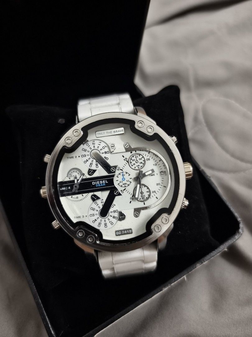 Diesel DZ-7418 White Chronograph Watch (Category: Men's Watches) located in Angeles City. Submitted by measaliman02351 (Listing ID 1469112134, Image 3). Description: - Brand/Model: Diesel DZ-7418 - Color: White and silver - Design: Bold large face with multiple dials and four separate time zones - Strap: Ceramic and stainless steel bracelet with deployment clasp - Inclusion: Original black presentation box with barcode sleeve - Condition: Excelle