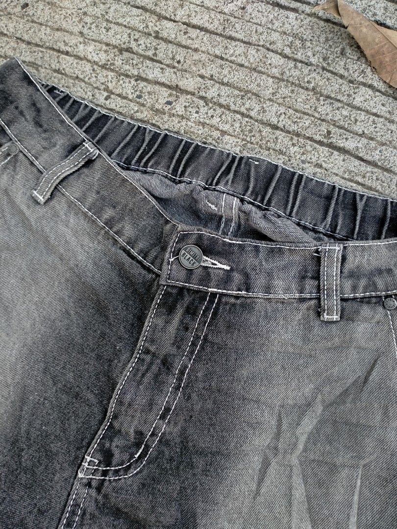 Dimitri Black Acid Wash Carpenter Jeans (Category: Jeans) located in Davao. Submitted by ervinpolino09 (Listing ID 1469008070, Image 3). Description: - Brand/Style: Dimitri Black carpenter jeans Size 30-34 Length 41 Stretchable - Fit: Relaxed, wide-leg fit with elastic back waistband - Details: Double knee panels, contrast stitching, and acid wash finish - Features: Button closure with branded hardware, utility hammer loop, and back pockets - Con