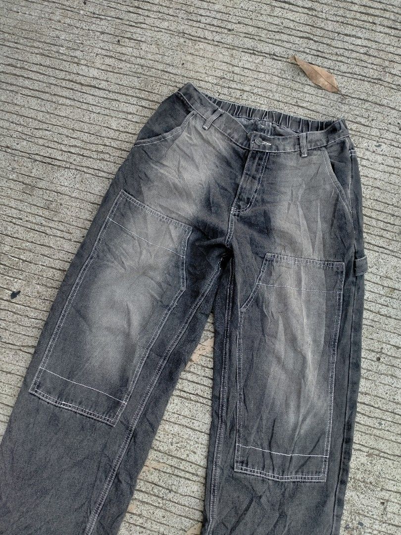 Dimitri Black Acid Wash Carpenter Jeans (Category: Jeans) located in Davao. Submitted by ervinpolino09 (Listing ID 1469008070, Image 2). Description: - Brand/Style: Dimitri Black carpenter jeans Size 30-34 Length 41 Stretchable - Fit: Relaxed, wide-leg fit with elastic back waistband - Details: Double knee panels, contrast stitching, and acid wash finish - Features: Button closure with branded hardware, utility hammer loop, and back pockets - Con