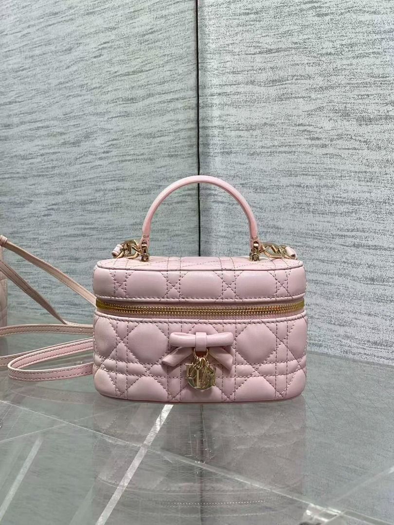 Dior Pink Cannage Leather Vanity Case (Category: Luxury Bags & Wallets) located in Navotas City. Submitted by ciputsurti69538 (Listing ID 1469021485, Image 1). Description: - Authentic Pink Dior Vanity Bag - Crafted from luxurious lambskin leather with classic Cannage quilting - Elegant top handle design with polished gold-tone hardware - Cute front bow accent featuring dangling Dior charms - Secure zip-around closure - Pink leather interior with
