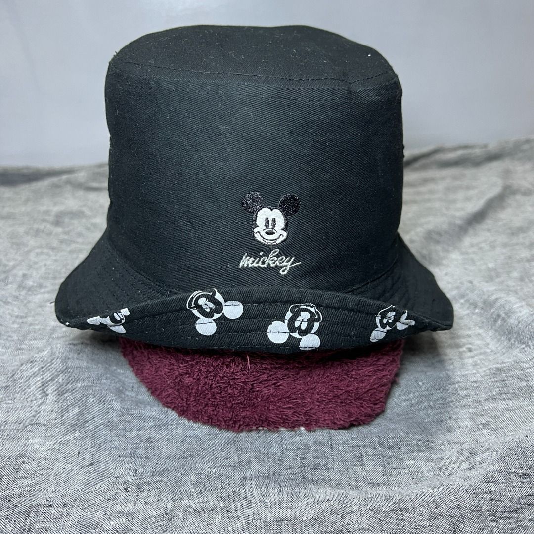 Disney Mickey Mouse Black Embroidered Reversible Bucket Hat (Category: Hats & Beanies) located in Talisay. Submitted by sidequested.archive (Listing ID 1469079372, Image 1). Description: 📝Details • Condition: Pre-loved in good overall condition with clean Mickey Mouse embroidery and printed brim; minor signs of wear and light lint visible. • Color rating: 10/10 • Measurements (in inches): 22 inches ( M - L ) Overall rating: 10/10 💰 Price: ₱350 